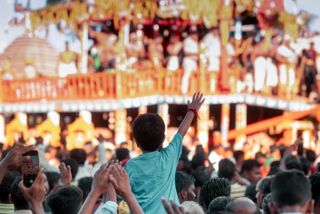 A joyful festival scene in Puri, India showing a lively gathering with colorful decorations and cultural performances.